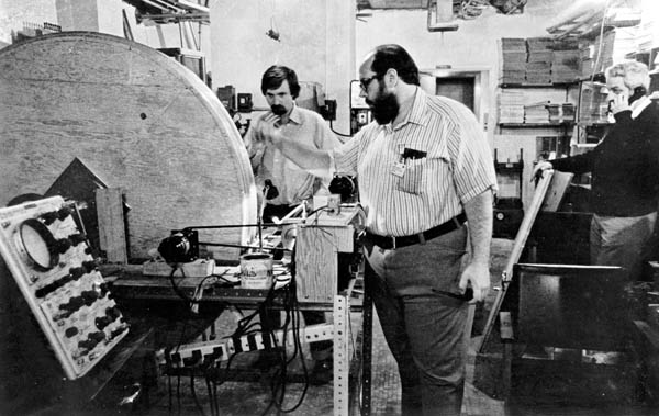 Fig.14. Michael Goldsmith, Raymond Damadian and Michael Stanford beginning the winding of thirty miles of Niobium Titanium wire on one of the two solenoid (circular) winding frames that would compose Indomitable's MRI magnet.